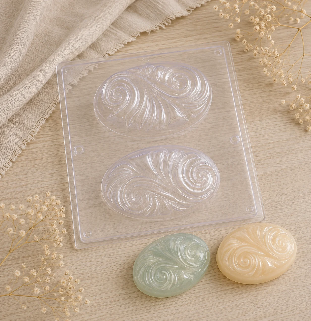 Two cavities to make oval soap bars with a decorative swirl on the face