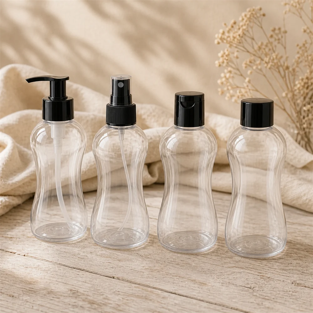 Four clear PET Bella bottles fitted with gloss black closures: lotion pump, mist spray, flip cap and screw cap
