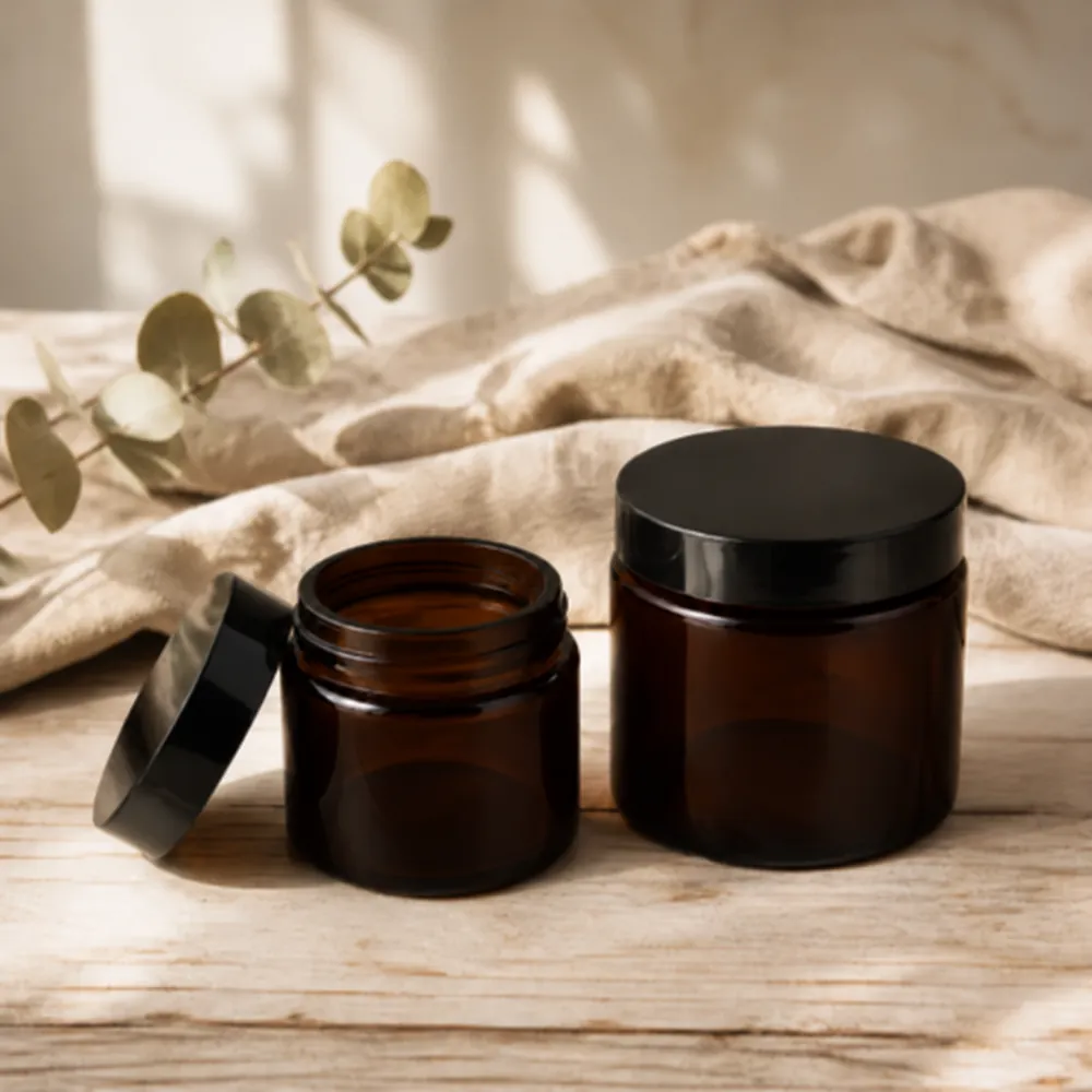 Amber glass lotion jars in 50ml and 100ml with black screw lids